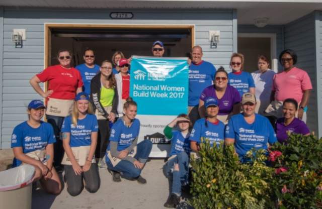 VOLUNTEER AS A GROUP. A group of volunteers at National Women Build Week 2017)